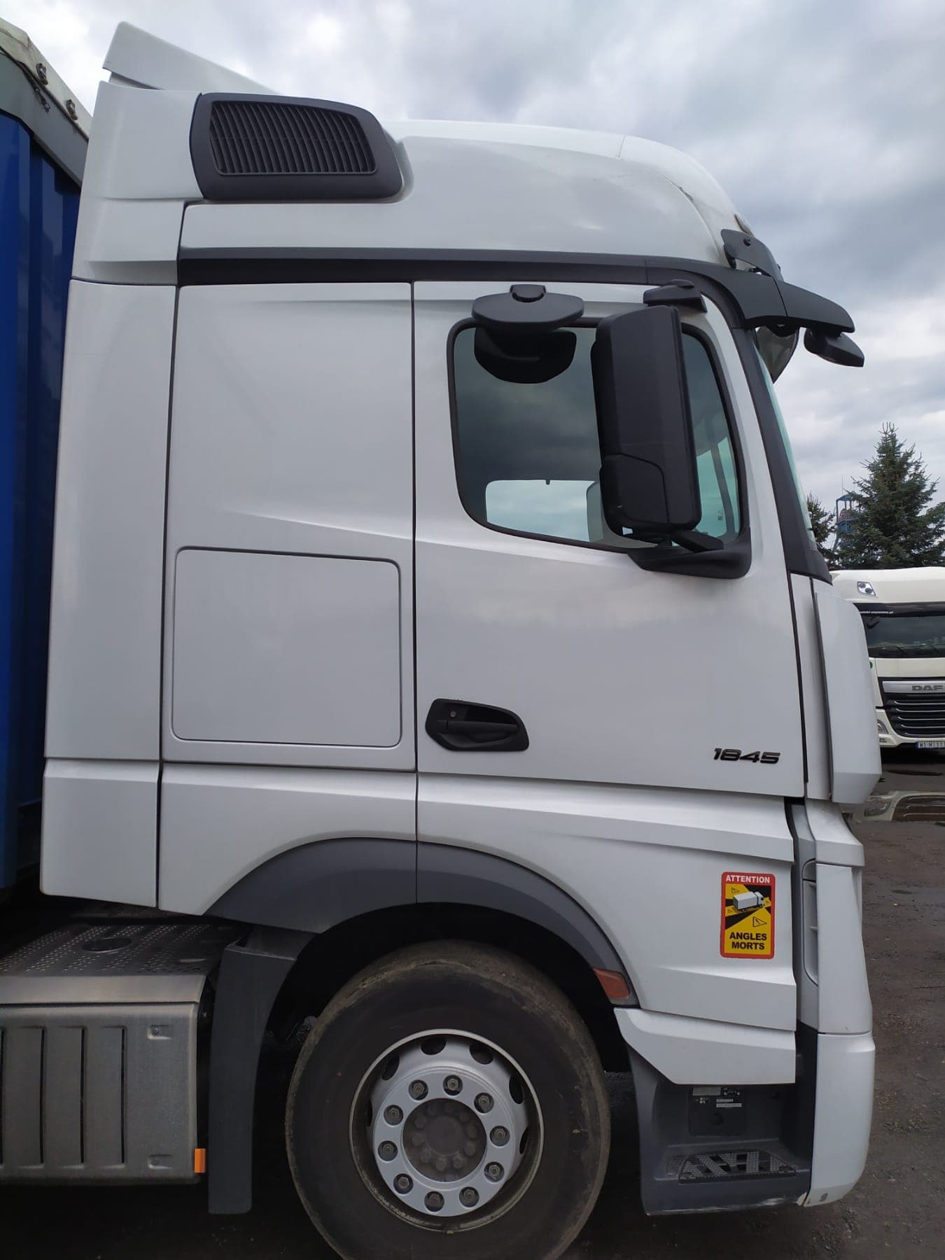 White Mercedes-Benz Actros 1845 cab parked at the yard
