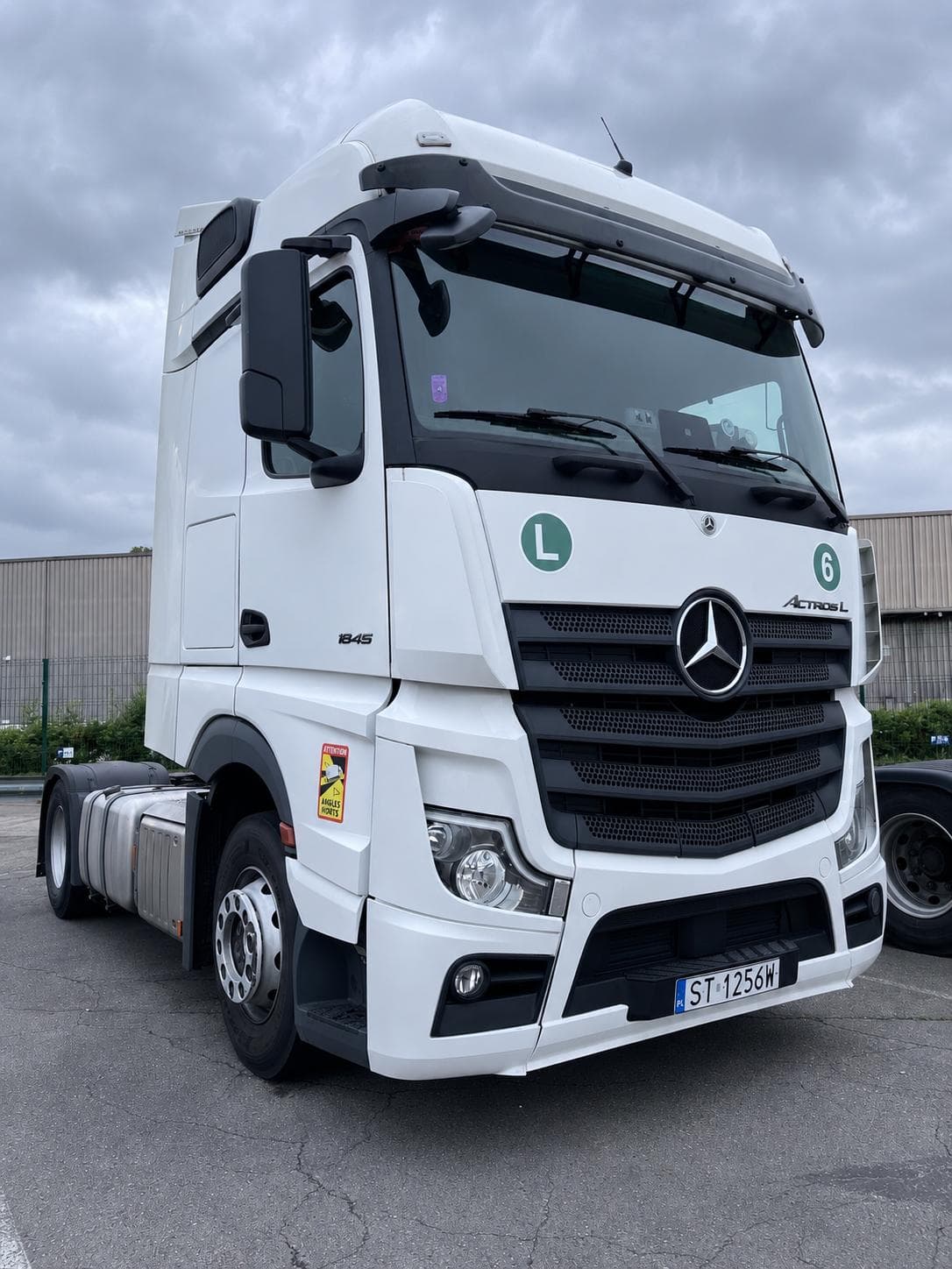 Front three-quarter view of a white Mercedes-Benz Actros L 1845